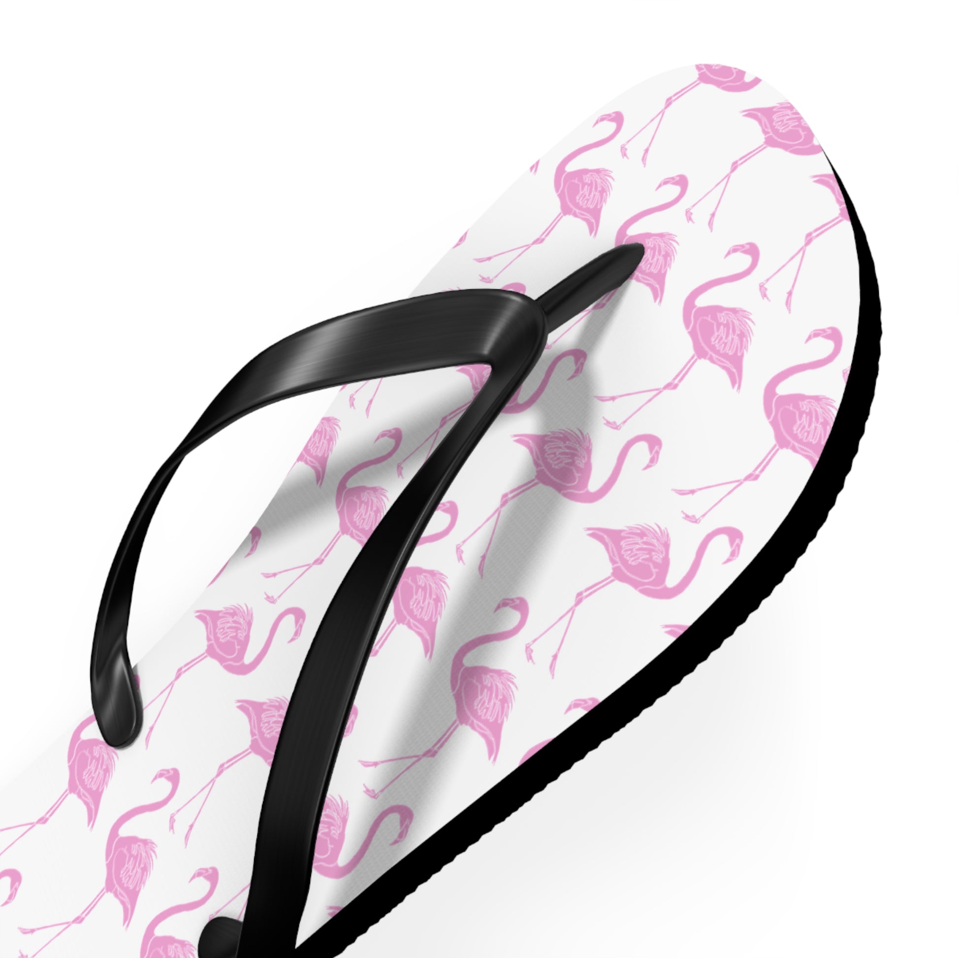 Flip-flop with pink flamingo pattern on a white background
