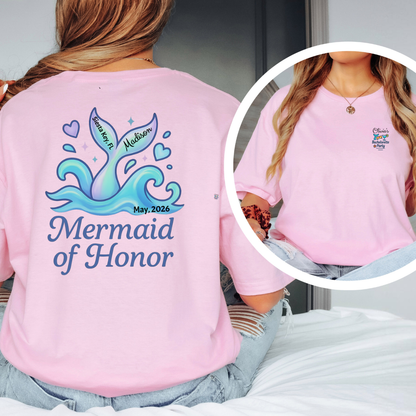 Pink t-shirt with 'Mermaid of Honor' design on the back, worn by a person.