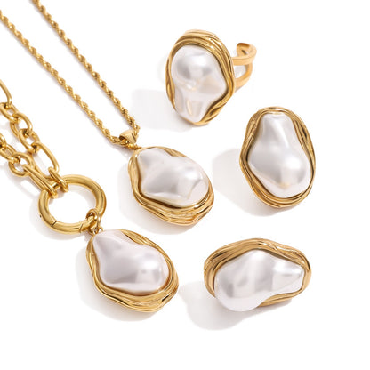 Modern pearl jewelry with asymmetrical design and polished gold frame