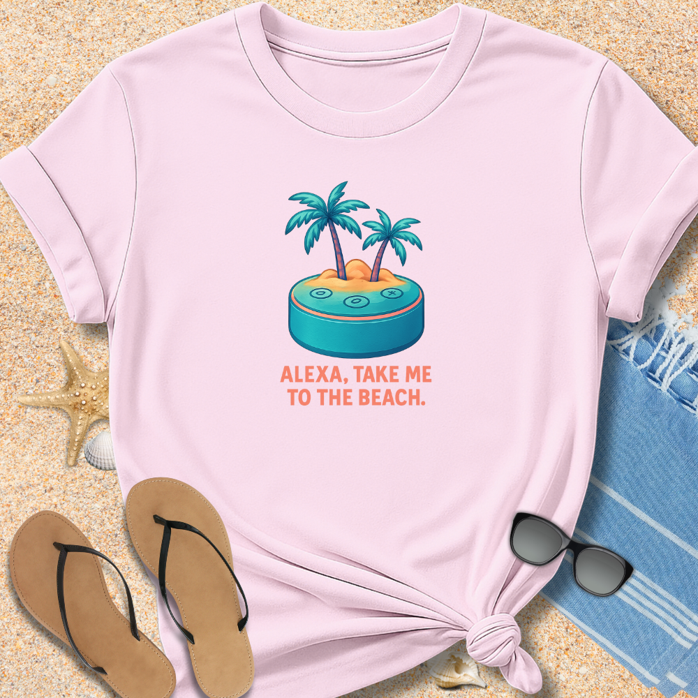 Pink t-shirt with beach graphic and text 'Alexa, take me to the beach' on sand with flip-flops and sunglasses.