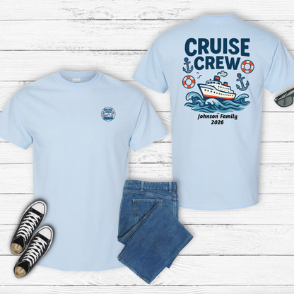 Light blue t-shirt with 'Cruise Crew' design on a wooden surface with jeans and sneakers.