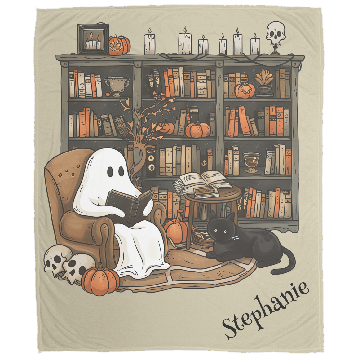 Blanket with a ghost reading a book and a black cat in front of a bookshelf with Halloween decorations.