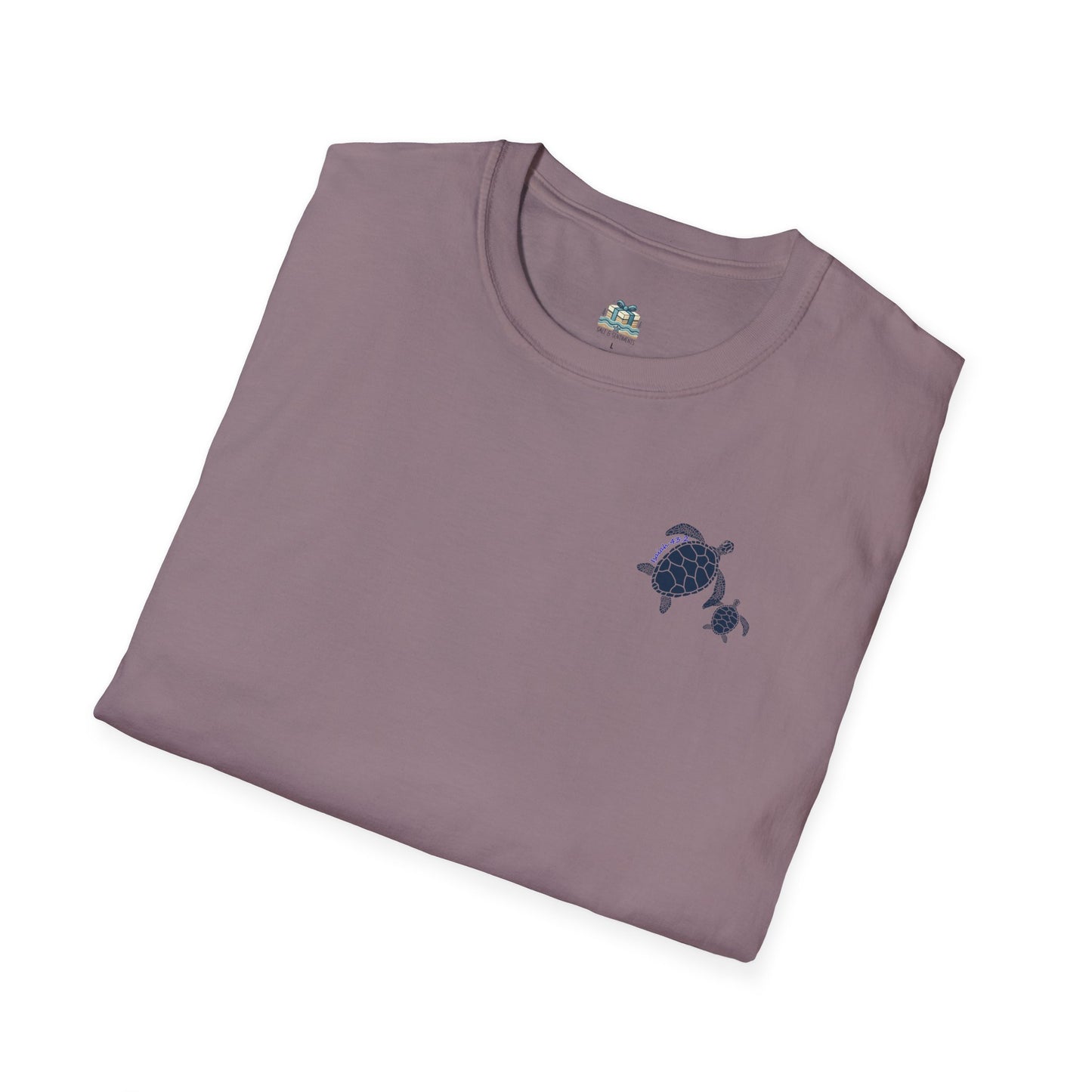 Folded purple t-shirt with a turtle design on a white background