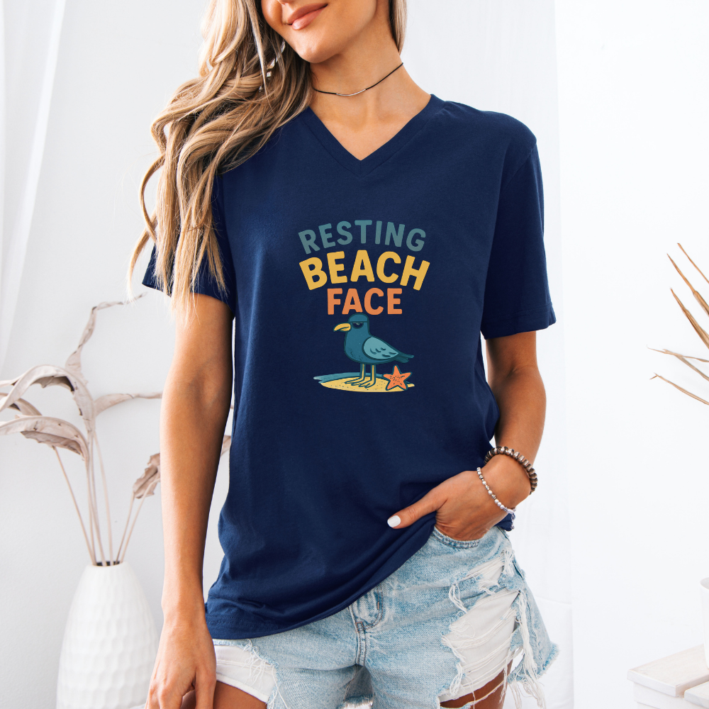 Person wearing a navy blue t-shirt with 'Resting Beach Face' text and graphic.