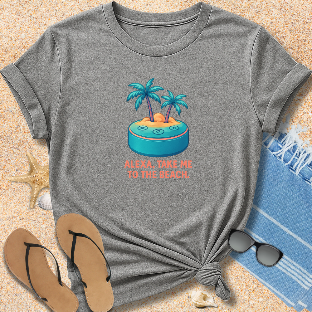 Gray t-shirt with beach graphic and text on sand with flip-flops and towel.