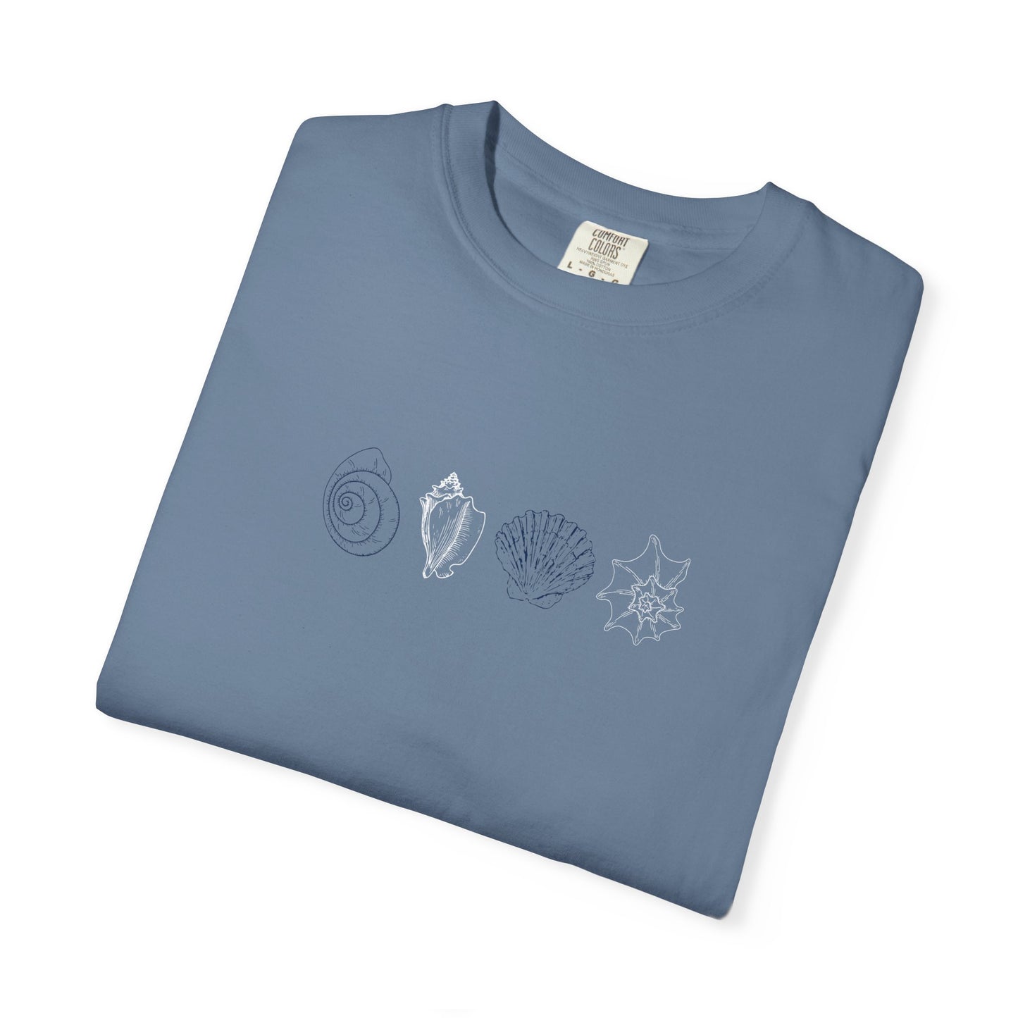 Folded blue Comfort Colors t-shirt featuring coastal shell line art