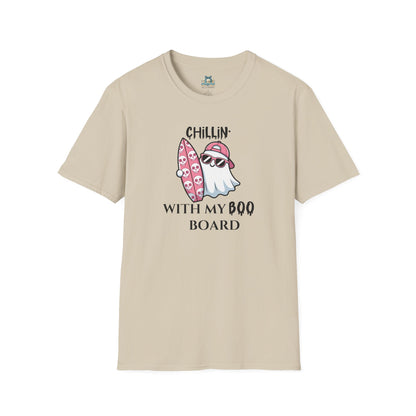 Tan T-shirt with ghost in sunglasses holding a pink surfboard with skulls