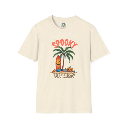 Beige t-shirt with Halloween-themed design featuring a palm tree, surfboard, and pumpkins on a white background.