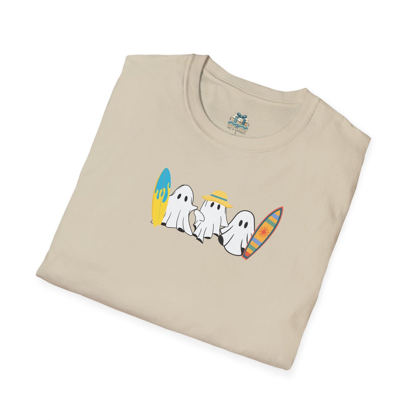 Folded beige t-shirt with ghost graphic design on a white background