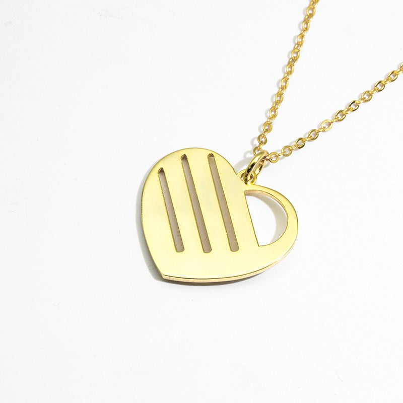 Back side of Gold heart-shaped pendant necklace on a white background