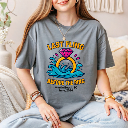 Person wearing a t-shirt with a 'Last Fling Before the Ring' design, sitting on a couch.
