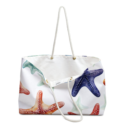 Tote bag featuring colorful fish pattern on a deep blue background with white handles, size 18x18 inches. It is open slightly to show the white liner on the inside.

