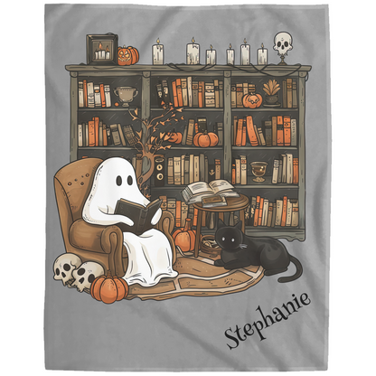 Ghost reading a book with a cat on a bookshelf filled with books and Halloween decorations, featuring the name 'Stephanie'.