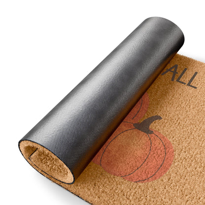 Doormat with pumpkin design and 'All' text, rolled up on a white background