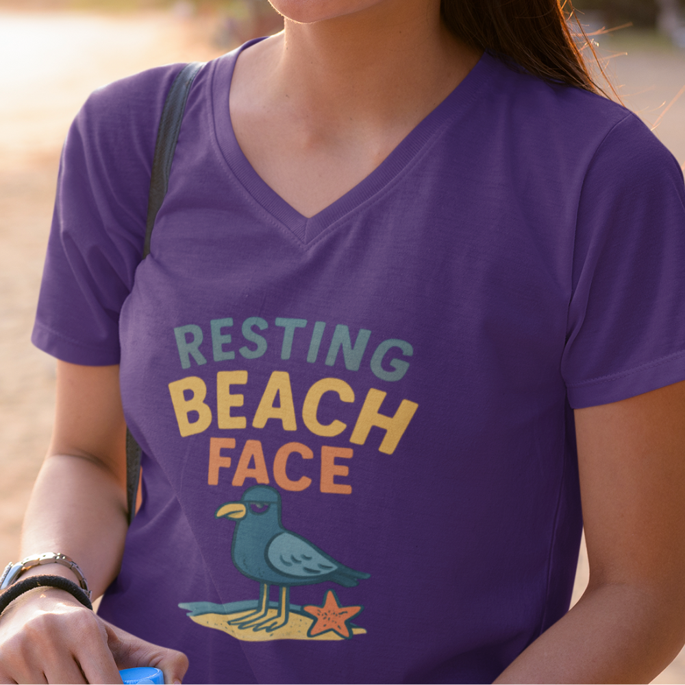 Person wearing a purple t-shirt with 'Resting Beach Face' design.