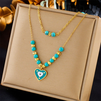 Butterfly and heart-shaped charm necklaces with luxurious detailing and pearl accents