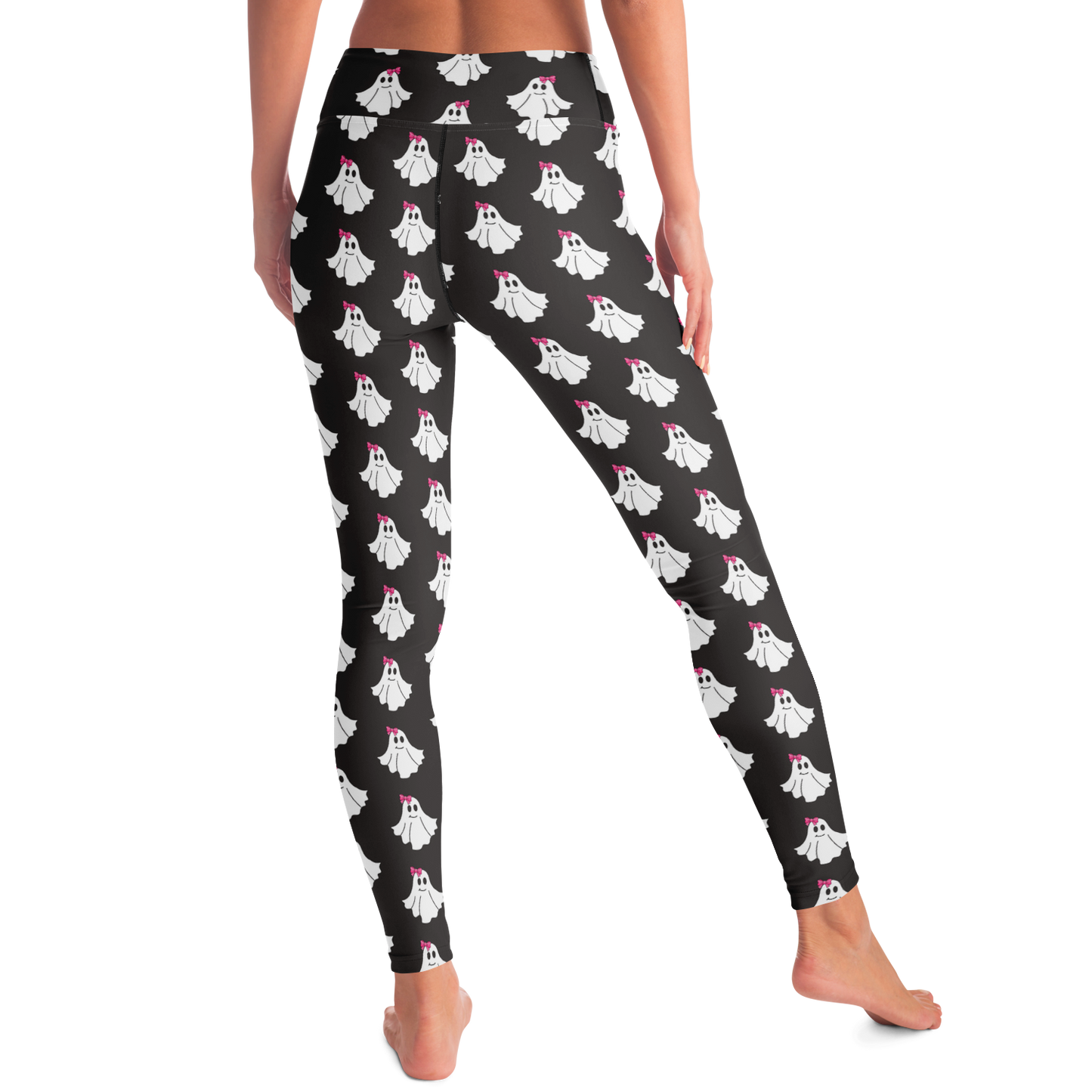 Black leggings with white ghost pattern worn by a person on a white background