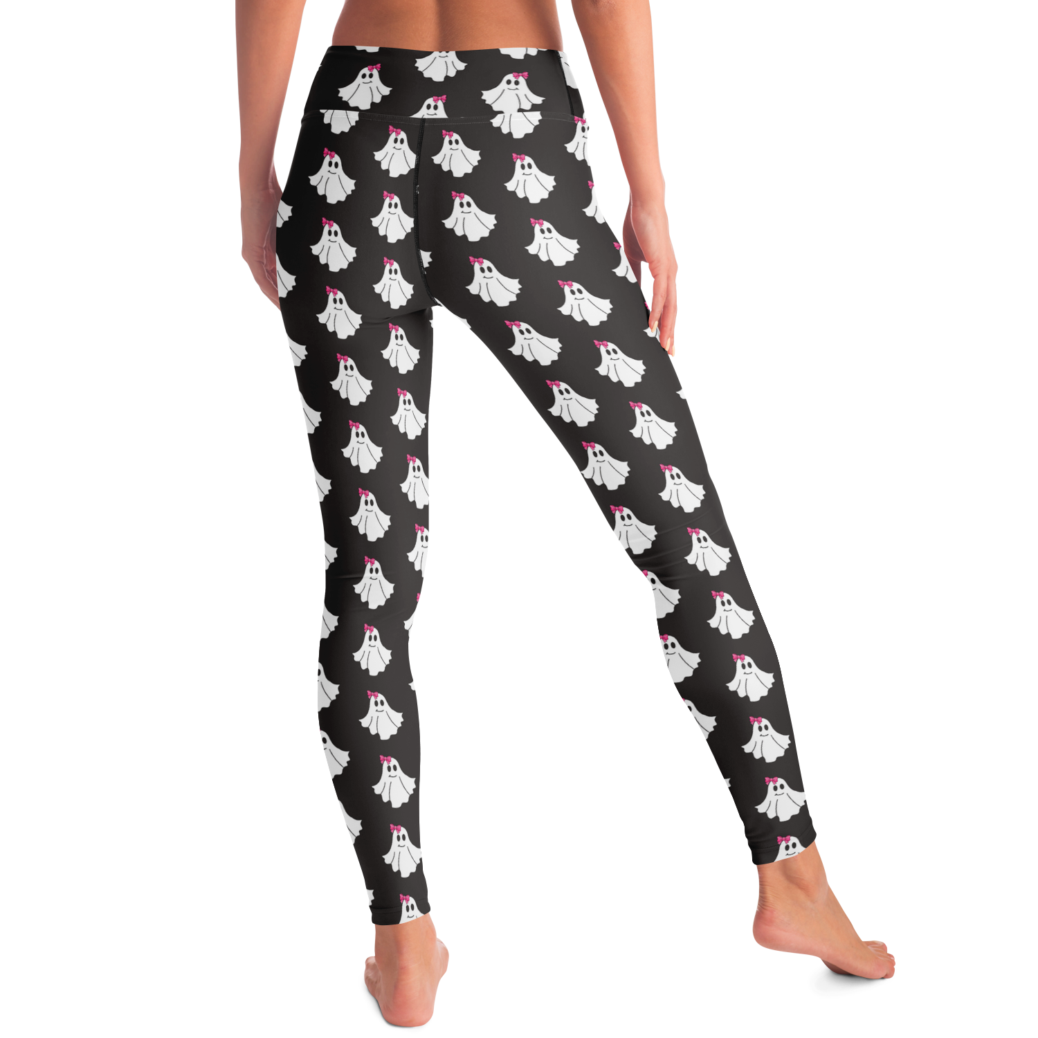Black leggings with white ghost pattern worn by a person on a white background