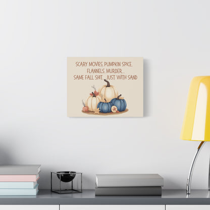 Decorative wall sign with pumpkins and text on a white wall above a shelf.