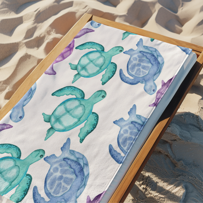 Sea turtle beach towel with watercolor design in teal, blue, and purple