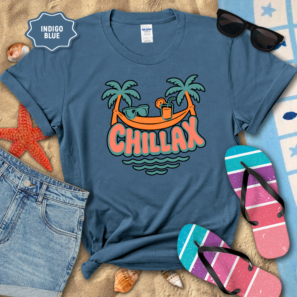 Blue t-shirt with 'Chillax' design on a beach setting with sunglasses, flip-flops, and shorts.