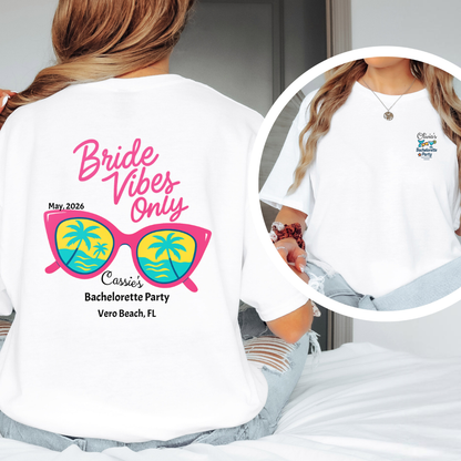 White t-shirt with 'Bride Vibes Only' design featuring sunglasses and palm trees, worn by a person.
