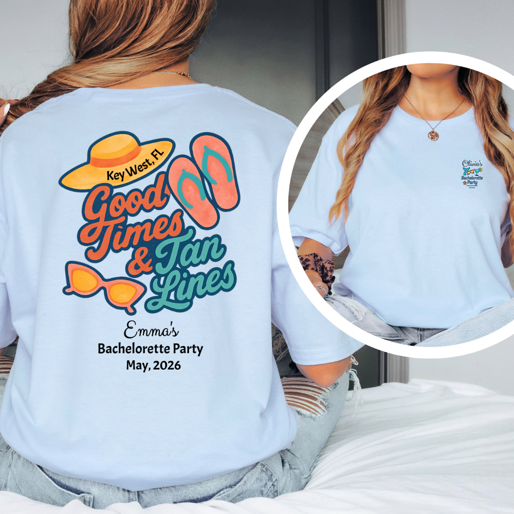 Light blue t-shirt with 'Good Times & Tan Lines' design on the back, worn by a person.