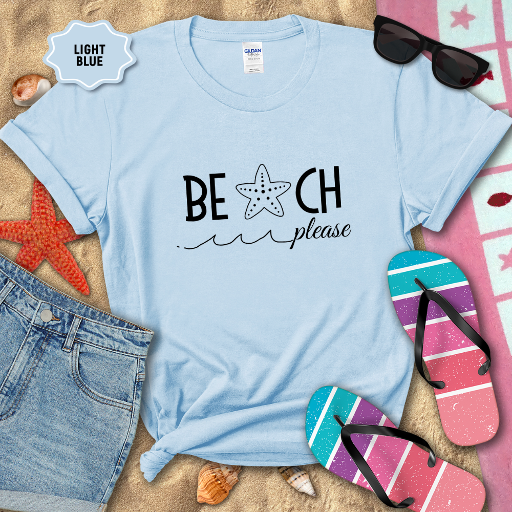 Light blue t-shirt with 'BEACH please' text on a sandy background with beach accessories.