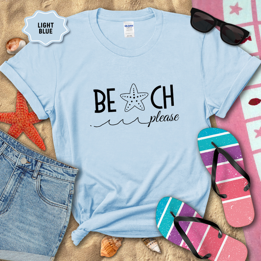 Light blue t-shirt with 'BEACH please' text on a sandy background with beach accessories.