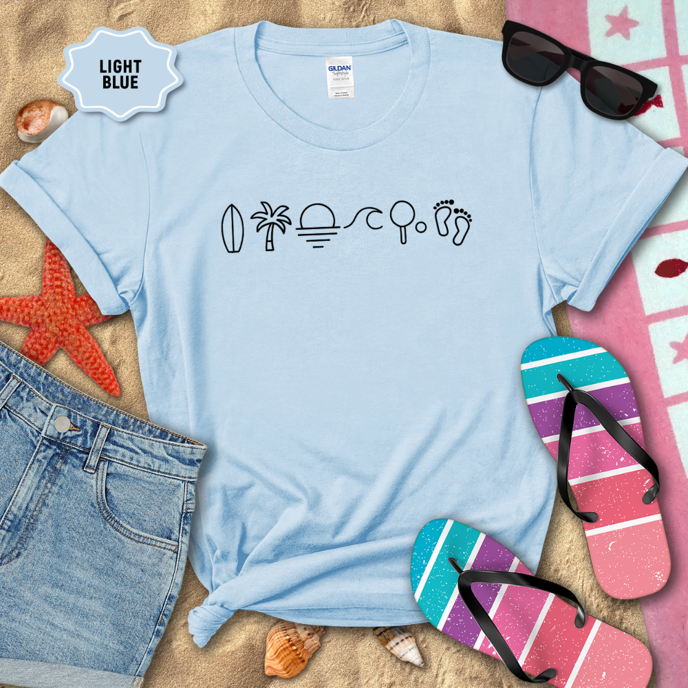 Light blue t-shirt with beach-themed icons on a sandy background with flip-flops and sunglasses.