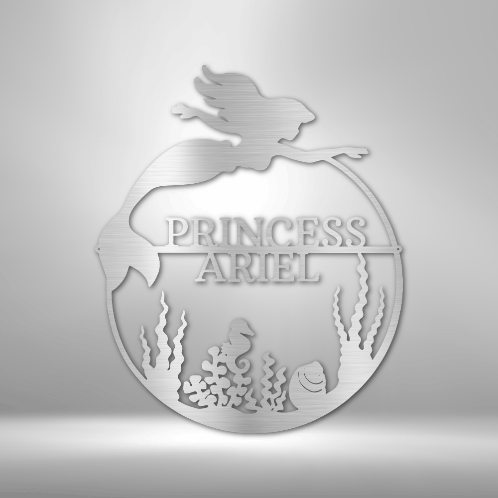 Decorative metal sign with 'Princess Ariel' design on a silver background