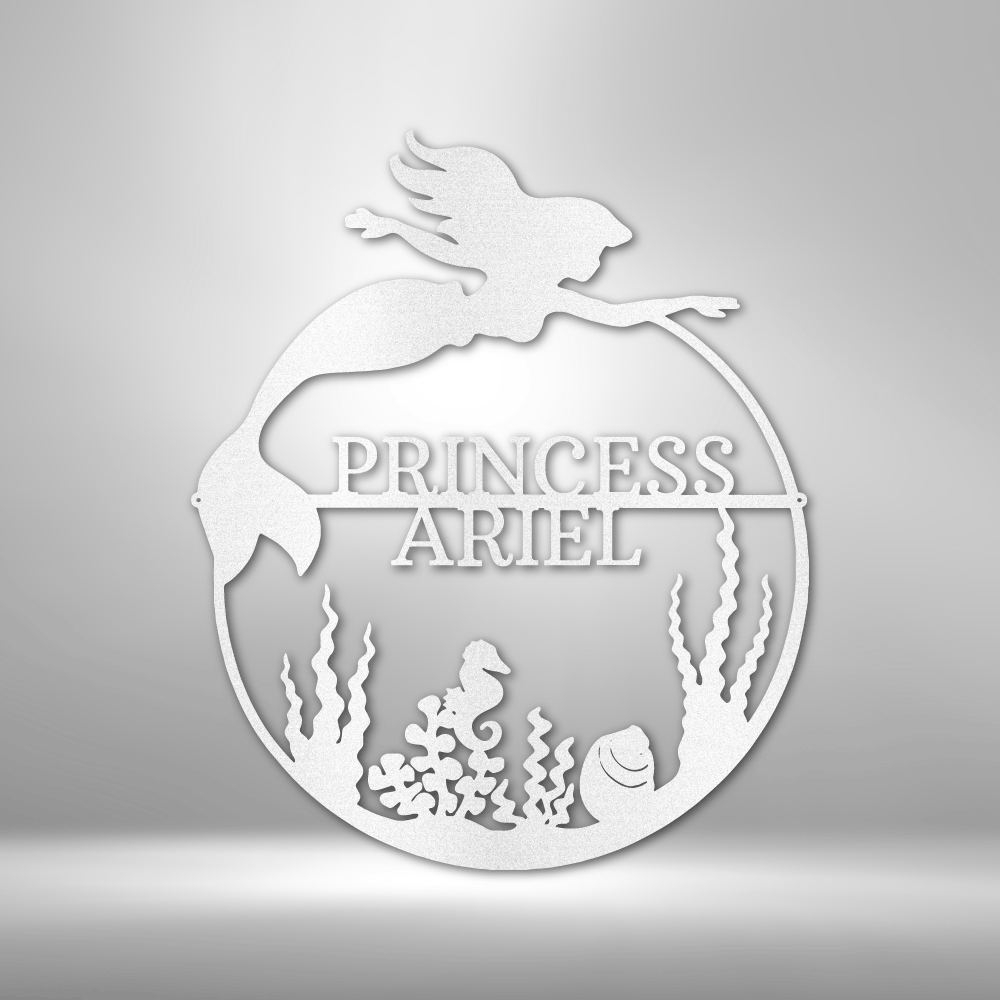 Decorative metal sign with 'Princess Ariel' design on a gray background