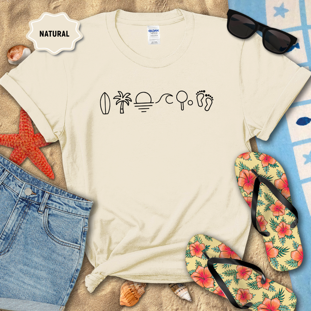 Beige t-shirt with beach-themed icons on a sandy background with flip-flops and sunglasses.