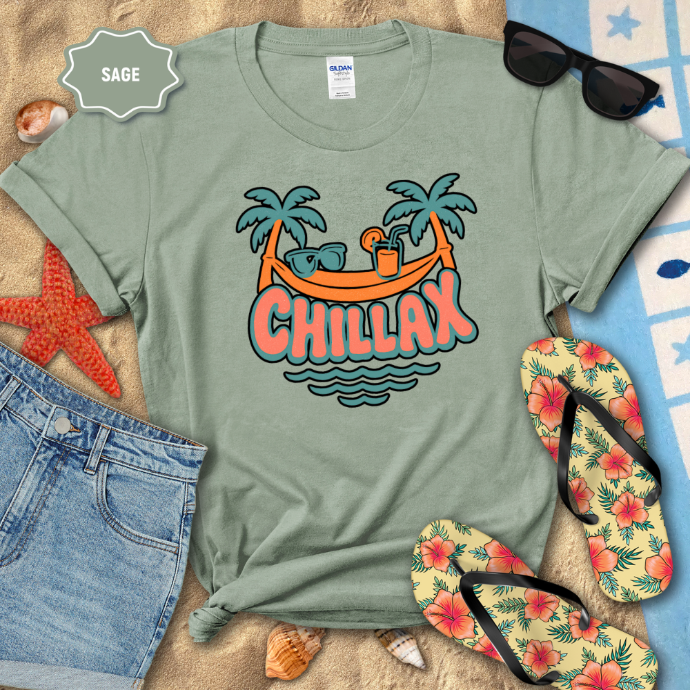 Sage green t-shirt with 'Chillax' graphic design on a beach setting with sunglasses, flip-flops, and starfish.