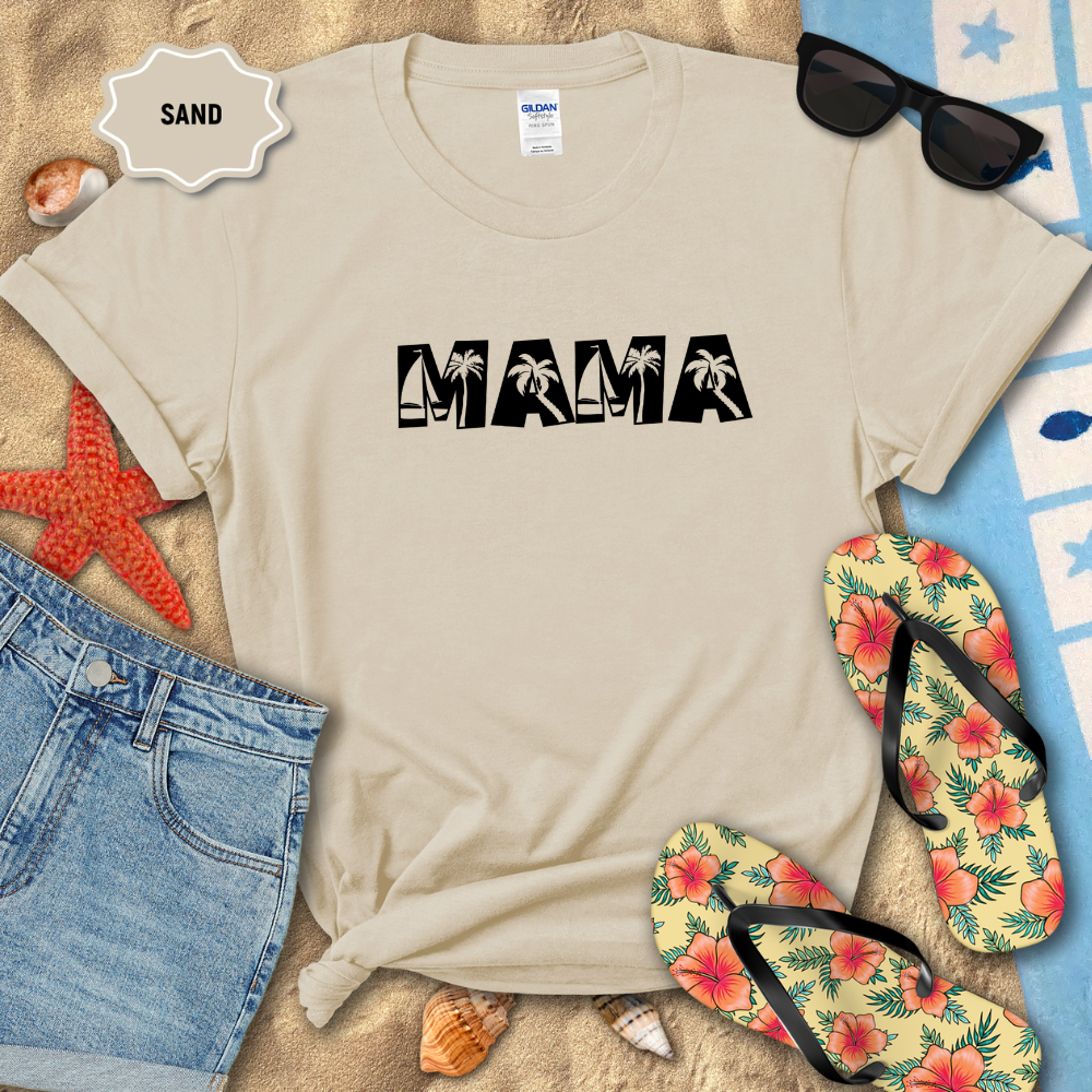 Beige t-shirt with 'MAMA' text, sunglasses, flip-flops, and beach items on sand