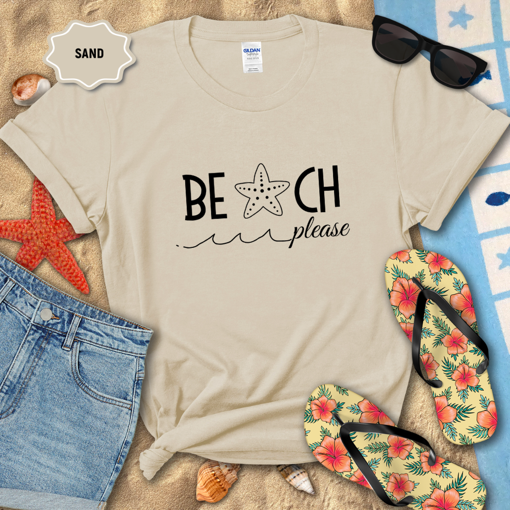 Beach-themed t-shirt with 'BEACH please' text, sunglasses, flip-flops, and sand on a sandy background.