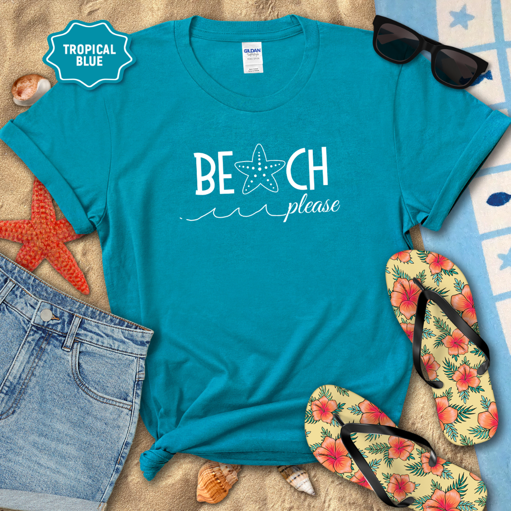 Blue t-shirt with 'Beach Please' text on a sandy background with flip-flops and sunglasses.