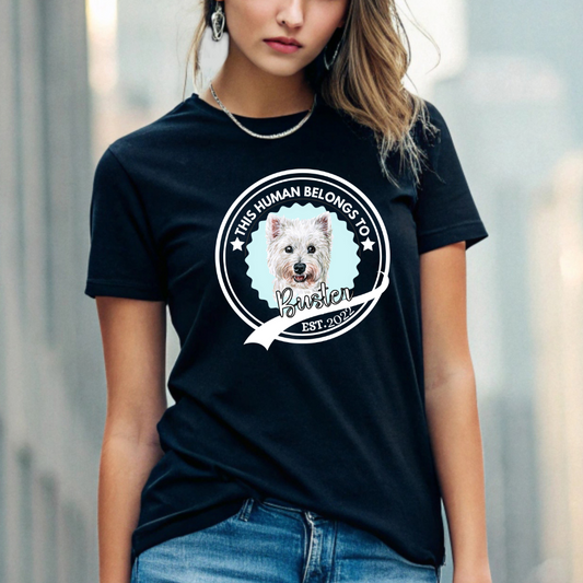 Personalized pet t-shirt for dog lovers featuring “This Human Belongs to Buster” design with custom pet portrait and name.