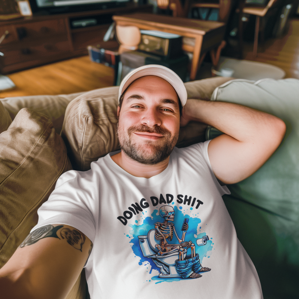Dad t-shirt with humorous graphic and relaxed fit with dad laying on a couch taking a selfie.