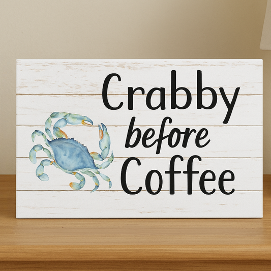 Wooden sign with a blue crab illustration and text 'Crabby before Coffee' on a beige background.