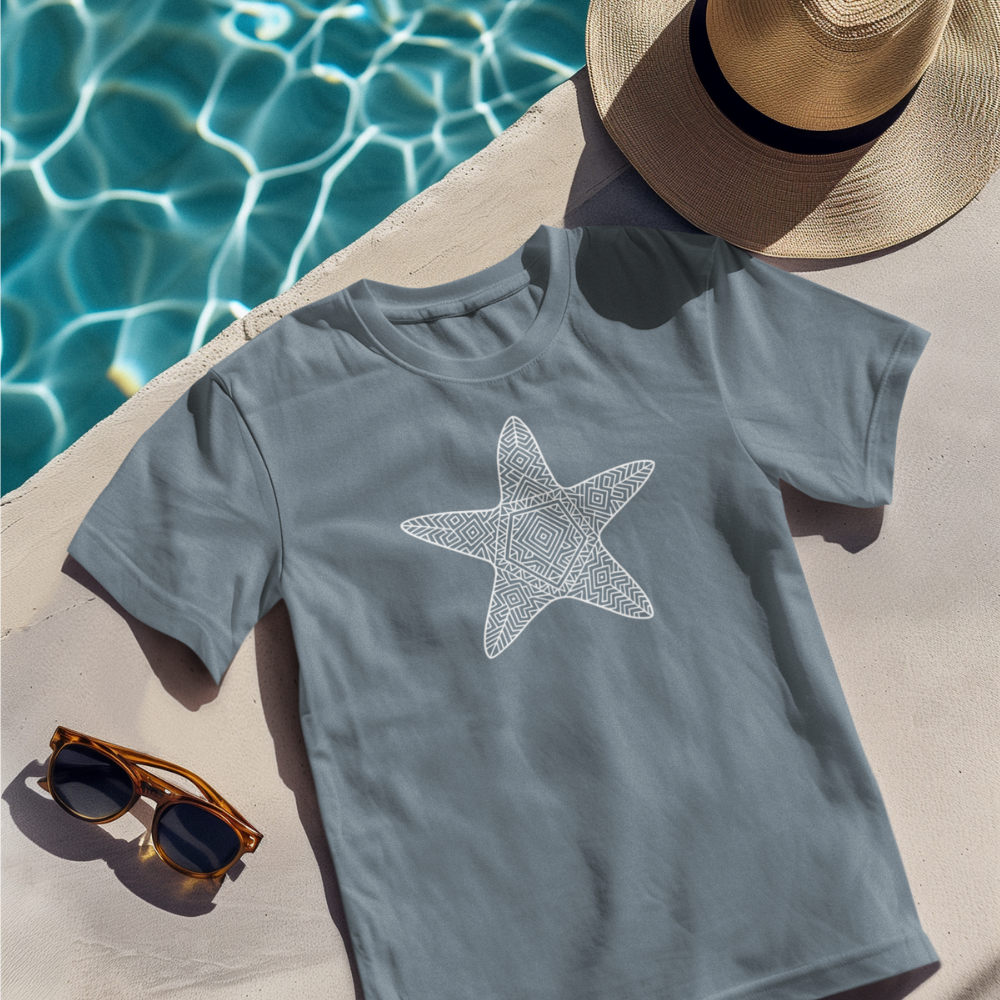 Heather Slate starfish t-shirt laid flat by poolside with sunglasses and hat

