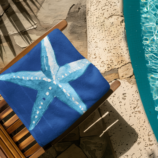 Navy blue beach towel with white seashell and sand dollar outlines
