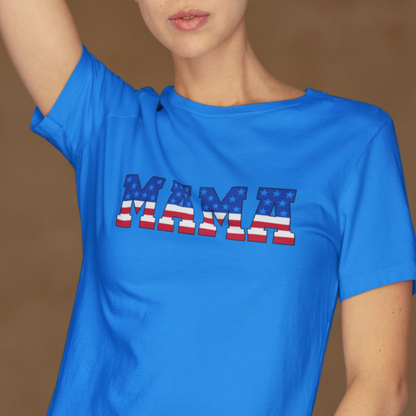 Woman wearing a blue T-shirt with “MAMA” in American flag print across the chest, showcasing a patriotic and stylish design.