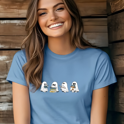Woman wearing a blue t-shirt with cartoon ghosts designs against a wooden background
