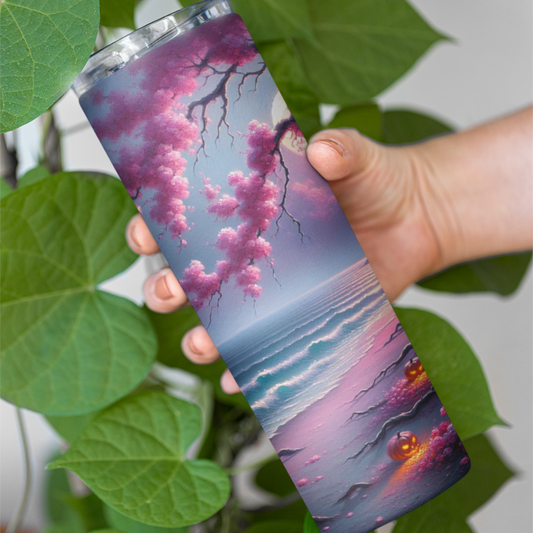 Tumbler with a cherry blossom design held by a hand against a green leafy background