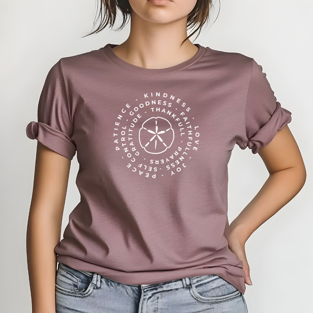 Person wearing a mauve t-shirt with white text design on a plain background