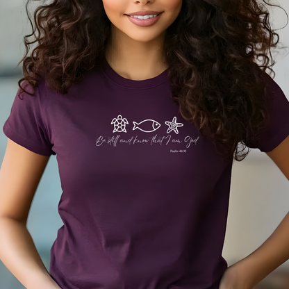Woman wearing a purple t-shirt with a design and text.