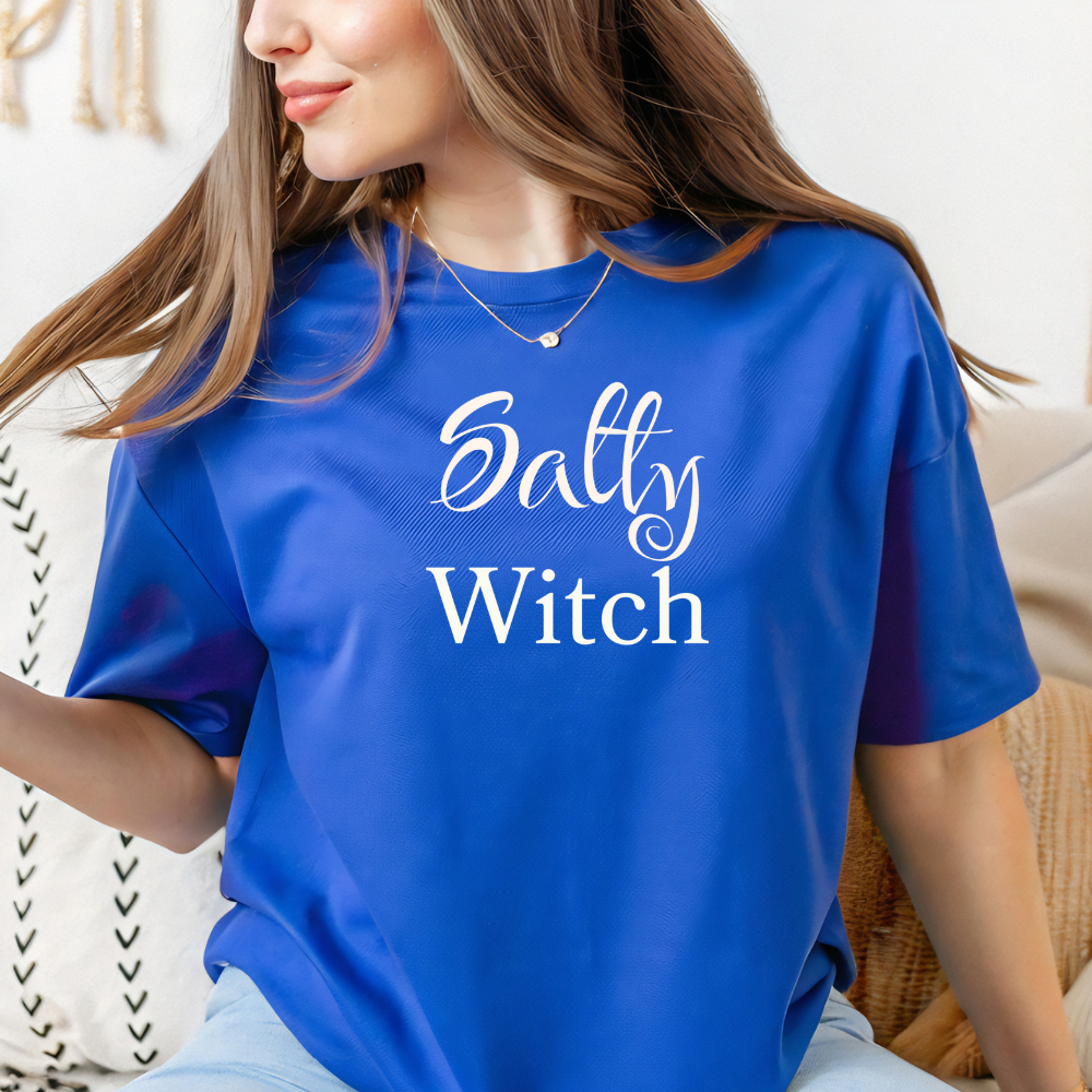 Woman wearing a blue t-shirt with 'Salty Witch' text.
