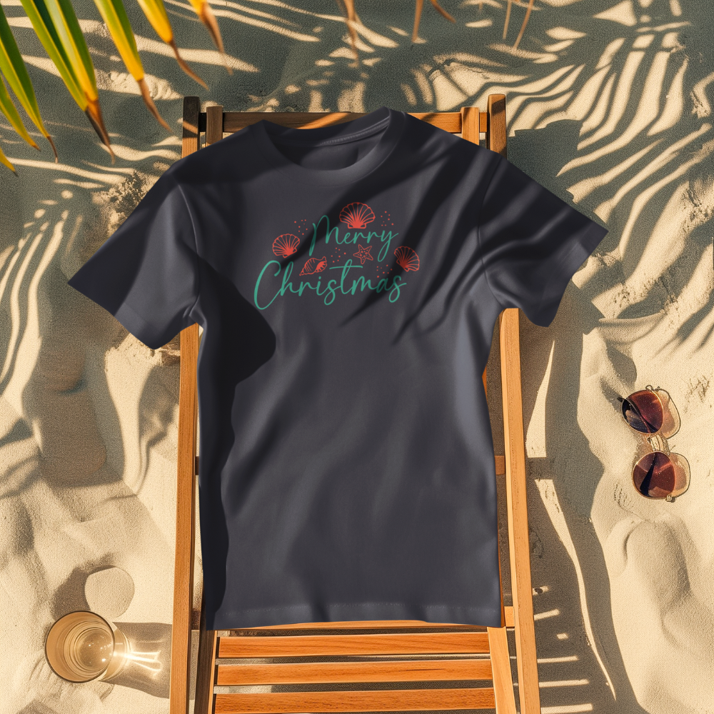Navy blue t-shirt with 'Merry Christmas' text on a wooden chair at the beach.