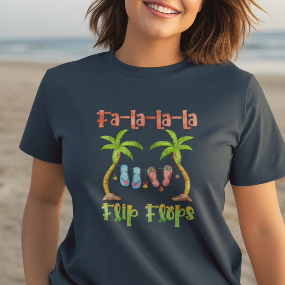 Person wearing a navy blue t-shirt with 'Fa-la-la-la Flip Flops' design on a beach.